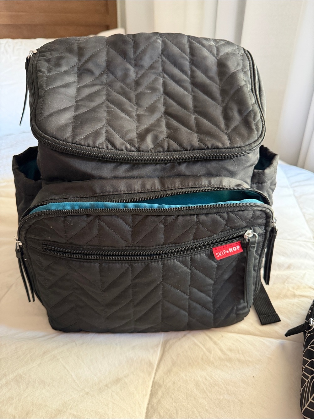 Skip Hop Black Quilted Backpack Diaper Bag with changing pad.